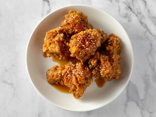 Crispy Fried Chicken Pieces Glazed with Sweet Sauce on Plate