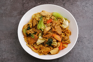 Kwetiaw or Kwetiau, fried rice noodles with meatballs and vegetables. Popular in Indonesia