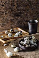 Quail Eggs Beautifully Arranged on Wooden Table with Rustic Background