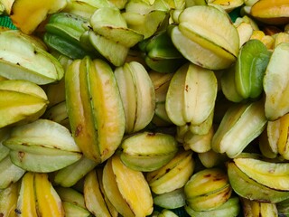 Pile of fresh delicious star fruit or Carambola open sell  in Indian market.