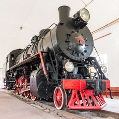 Obraz premium Vintage steam locomotive in a museum