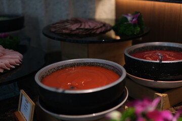 High Angle View of Various Comforting and Savory Gourmet Soups Served in Bread Bowls and Handled...