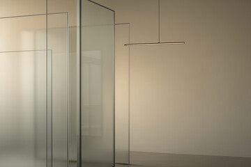 Minimalist interior featuring sleek glass partitions with a slim hanging light fixture, set against a neutral wall background, conveying modern design elegance. Background concept for Interior Design