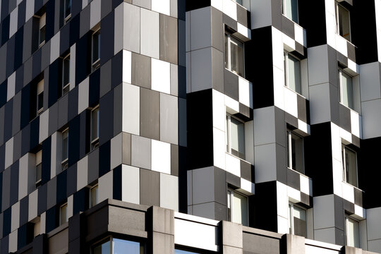 solar panel geometric front side facade commerce high rise skyscraper building monochrome black and white modern architecture background corner