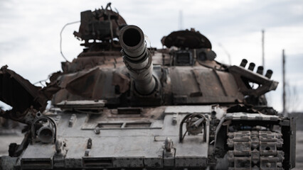destroyed houses and a military tank on the street of Kiev during the war in Ukraine