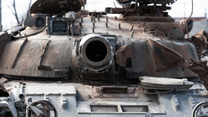 destroyed houses and a military tank on the street of Kiev during the war in Ukraine