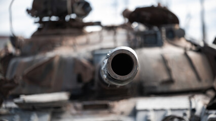 destroyed houses and a military tank on the street of Kiev during the war in Ukraine