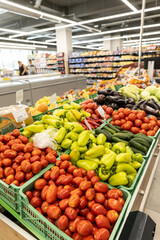 fresh summer fruits and vegetables in the supermarket on the shelf.