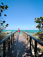 Woman in Red Dress on a Wooden Pier