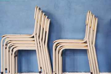 iron chairs stacked on top of each other
