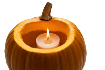 Carved pumpkin with a lit candle inside, isolated on transparent background