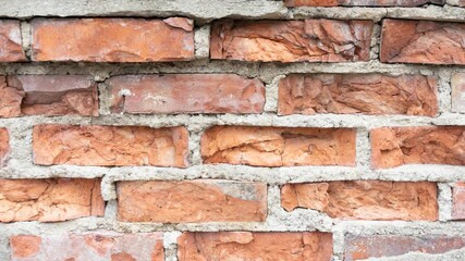 a wall made of old red bricks with peeling plaster - Powered by Adobe