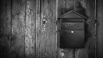 Rusty Mailbox on an Old Wooden Fence Vintage Rural Scene
