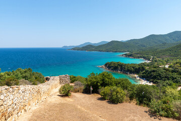 Stunning turquoise bays and lush green hills along Aegean coast near Stagira, Greece
