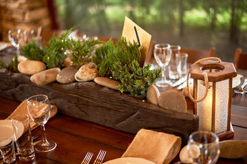 Decoration of wedding tables of guests in the Viking style. Heavy wooden tables and compositions...