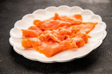 Smoked salmon fish seafood portion size natural product tasty snack fresh delicious gourmet food background on the table rustic top view copy space pescetarian diet