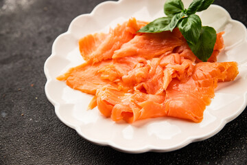 Smoked salmon fish seafood portion size natural product tasty snack fresh delicious gourmet food background on the table rustic top view copy space pescetarian diet
