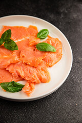 Smoked salmon fish seafood portion size natural product tasty snack fresh delicious gourmet food background on the table rustic top view copy space pescetarian diet
