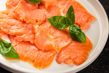 Smoked salmon fish seafood portion size natural product tasty snack fresh delicious gourmet food background on the table rustic top view copy space pescetarian diet