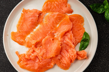 Smoked salmon fish seafood portion size natural product tasty snack fresh delicious gourmet food background on the table rustic top view copy space pescetarian diet