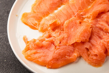 Smoked salmon fish seafood portion size natural product tasty snack fresh delicious gourmet food background on the table rustic top view copy space pescetarian diet
