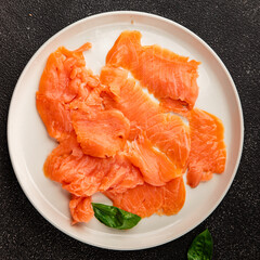 Smoked salmon fish seafood portion size natural product tasty snack fresh delicious gourmet food background on the table rustic top view copy space pescetarian diet