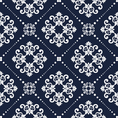 Elegant vintage pattern background. The pattern features detailed floral design in repeating geometric pattern. A seamless wallpaper design