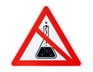 A triangular warning sign featuring a laboratory flask with a prohibition symbol, indicating a restriction on chemical substances.