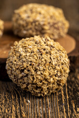 whole sweet marshmallows in chocolate sprinkled with crumbs from waffle , sweet dessert marshmallows in milk chocolate with crumbs