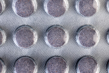 purple tablets made from natural ingredients packed in a blister , whole purple tablets packed in a...
