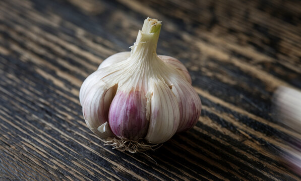 An extreme close-up of a garlic bulb on the table