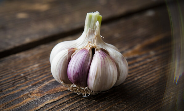 An extreme close-up of a garlic bulb on the table