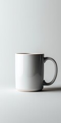Obraz premium Minimalist white ceramic mug with handle on light background