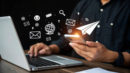 Engaging with digital communication, a person uses a smartphone to send messages and connect globally, symbolizing modern connectivity and outreach.