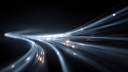 Luminous Fiber Optic Light Trails Curve Through Darkness, Symbolizing High-Speed Data Transmission.