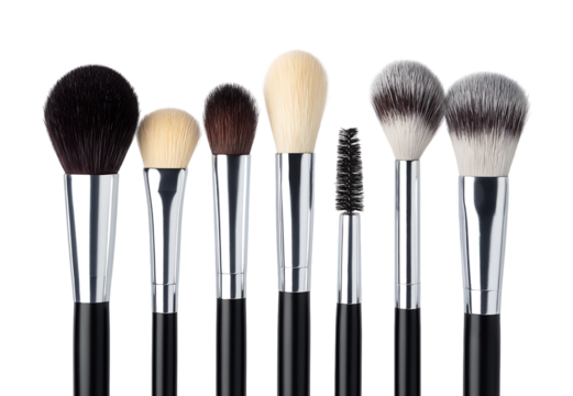 A luxurious collection of professional makeup brushes, including various face and eye brushes isolated on a transparent background