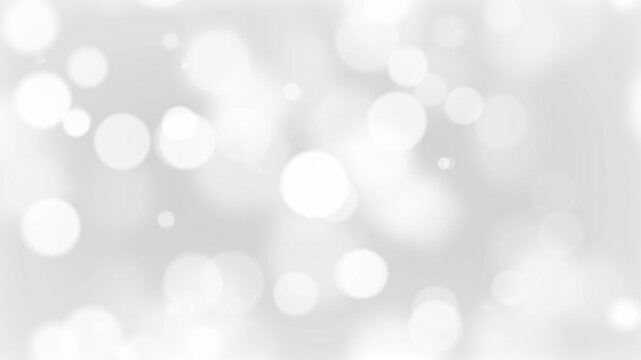 Soft white background Loopable 4K Abstract beautiful and blurred circles. Dreamy white Bokeh Background.