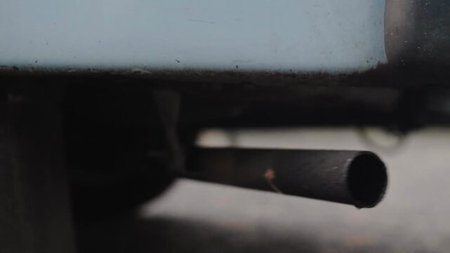 Trabi Trabant exhaust close up starting engine in Berlin, GDR era car