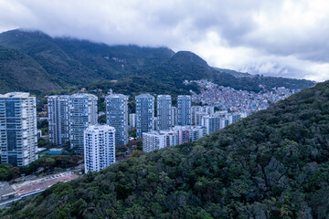 Obraz premium Aerial view of Sao Conrado Beach, Rio de Janeiro, Brazil. With the Rocinha favela in the background.