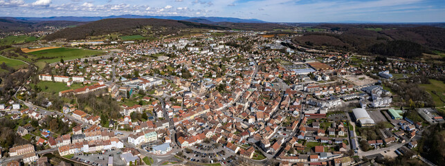 Aerial panoramic view around the old town and city Héricourt in France on a sunny afternoon