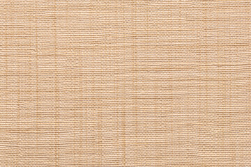 Close-up texture of a light beige canvas bag with interwoven threads