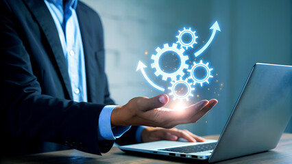 Businessman showcasing innovative digital gears and growth arrow, symbolizing business progress and technological advancement with a laptop