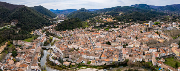 Aerial panoramic view around the old town and city Lodève in France on a sunny afternoon