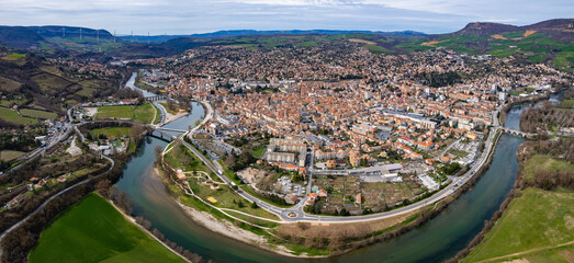 Aerial panoramic view around the old town and city Millau in France on a sunny afternoon