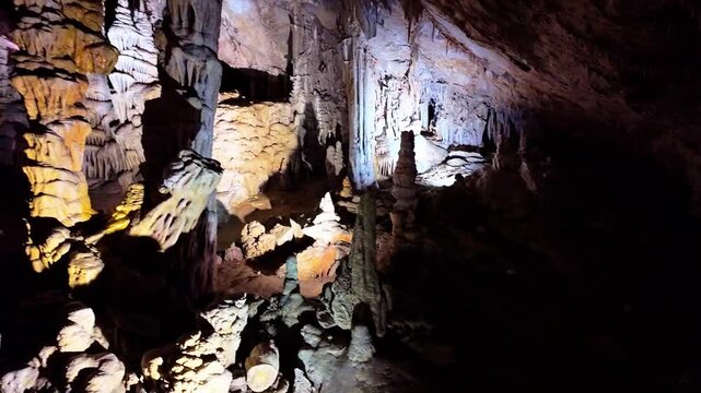 A scenic and illuminated view of the caverns inside Lewis and Clark Caverns State Park is captured, highlighting the stunning geological formations and the unique lighting that enhances their beauty