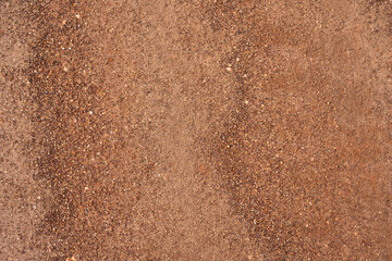 Dirt, terrain or gravel stone road surface pattern in outdoor environmental. Background and textured photo.	