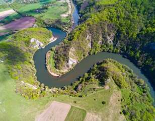 High-angle view of a meandering river winding through a valley