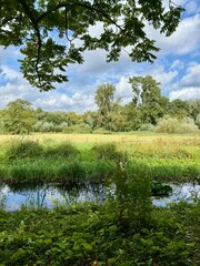 Amsterdam Vondelpark on a sunny autumn day with Dutch clouds
