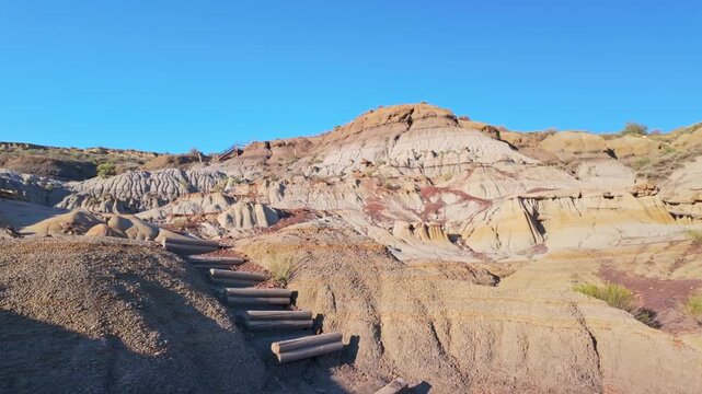 A dramatic sunset over the badlands formations of Makoshika State Park as seen from the Cap Rock Trail