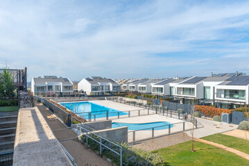 Multifunctional outdoor space featuring a barbecue area, urban garden, and a pool discreetly integrated into the overall design